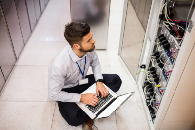 technician working at colocation data center 