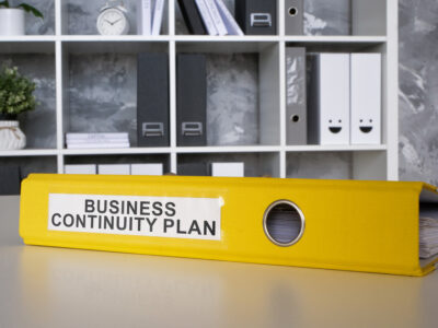 business continuity plan, yellow binder that has a comprehensive disaster recovery plan 