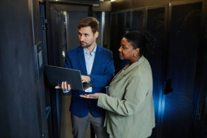 engineers checking servers for cloud data 