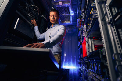 engineer working in colocation data center 