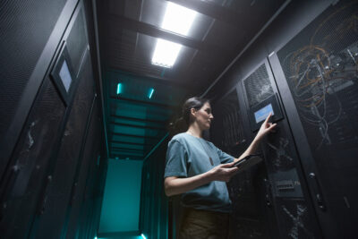 female engineer working in colocation data center 