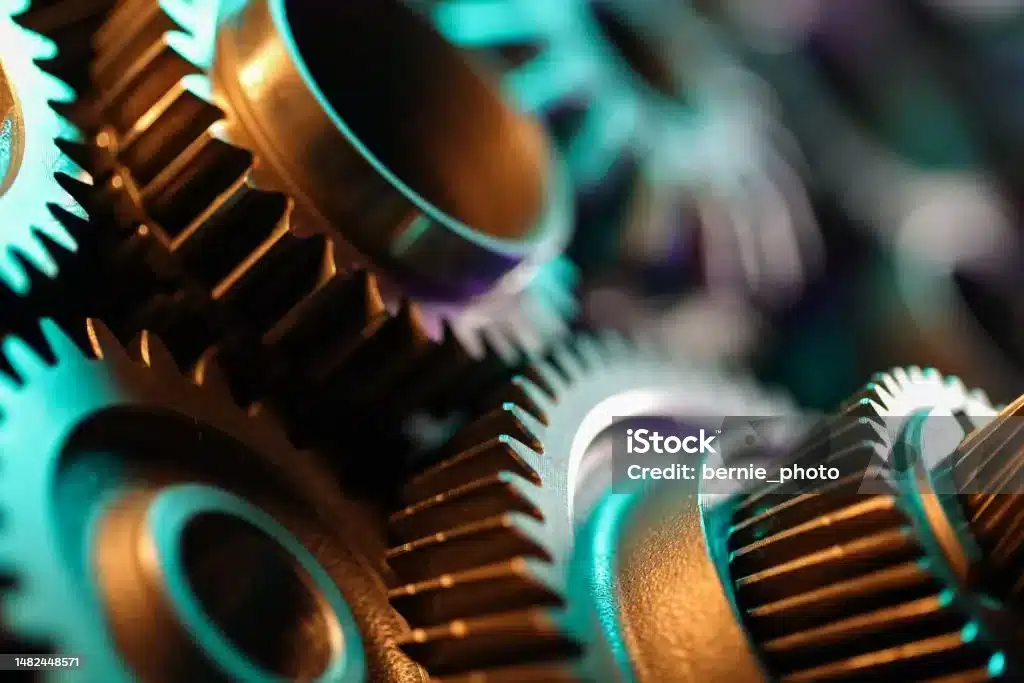 Abstract close-up of modern manufacturing equipment representing production continuity and infrastructure resilience.